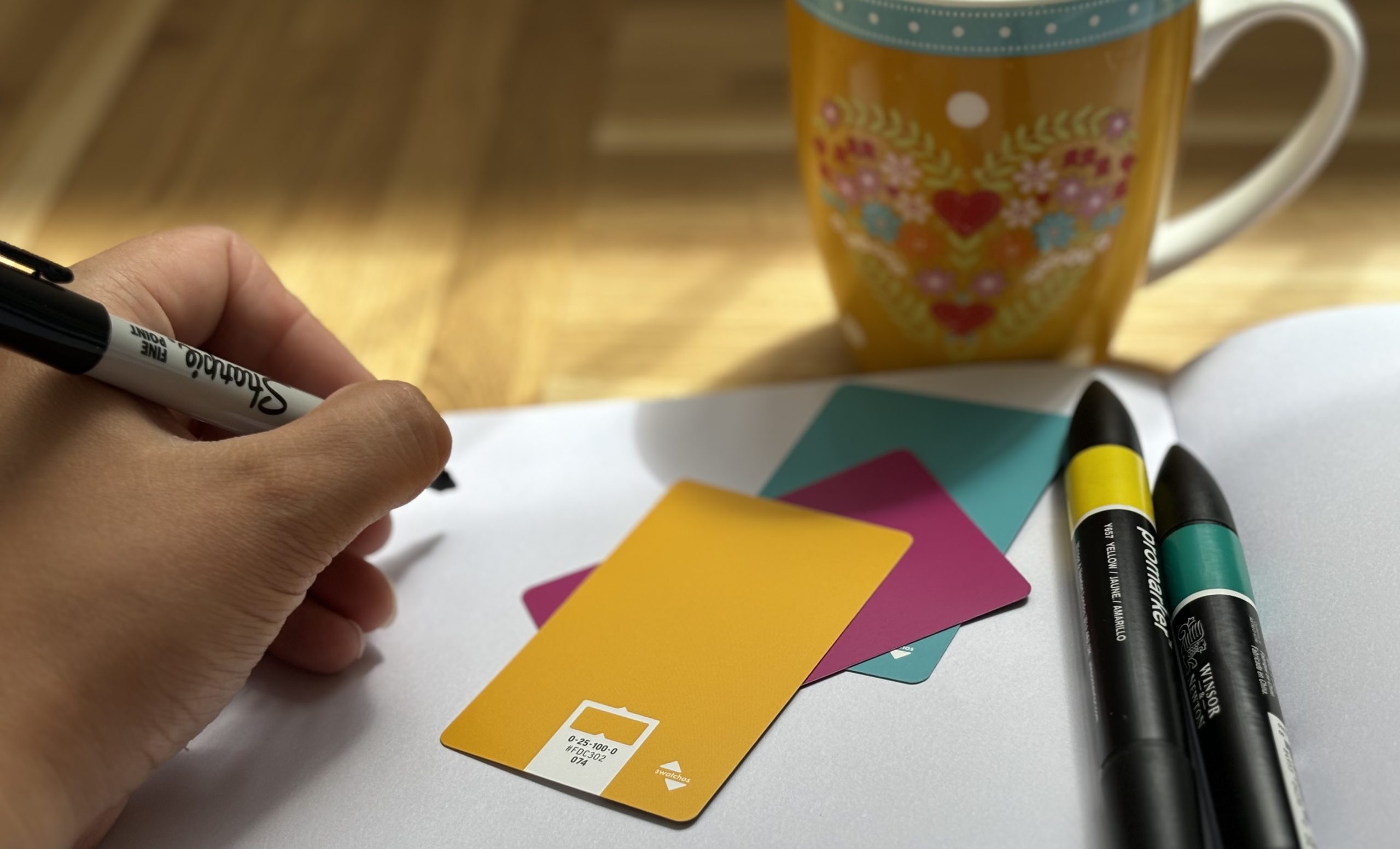 Graphic design equipment displayed on a creative desk layout.