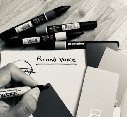 Black and white photo of a graphic designers desk.